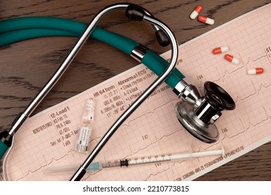 Medical Treatment - Doctors Stethoscope, Adrenaline Injection And An ECG Trace.