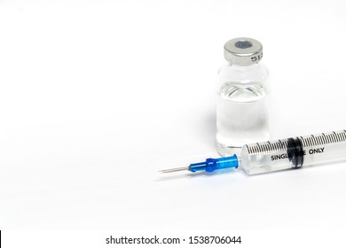 Medical vials for injection with a syringe isolated on white background