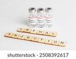 Medical Vials with a label reading the names of Lethal Injection Drugs and a sign reading Lethal Injection