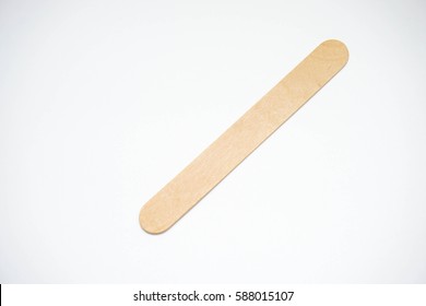 Medical Wooden Tongue Depressor On White Blackboard