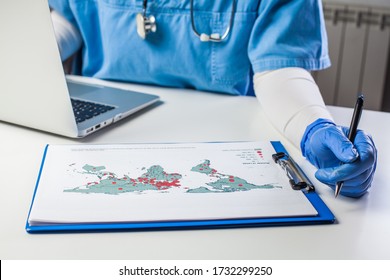 Medical Worker Analyzing COVID-19 World Map,Coronavirus Global Pandemic Outbreak Crisis,stats Showing Worldwide Number Of Infected Patients,death Toll And Mortality Rate,possible Infection New Wave