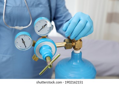 Medical worker checking oxygen tank in hospital room, closeup - Shutterstock ID 1902162151