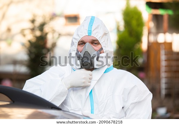 Medical worker dressing up for PCR diagnostic for\
Coronavirus, doctor in\
PPE.