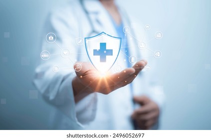 A medical worker holding of health care icons, medical technology background, health insurance business.Health Insurance, telemedicine, virtual hospital, family medicine concept. - Powered by Shutterstock