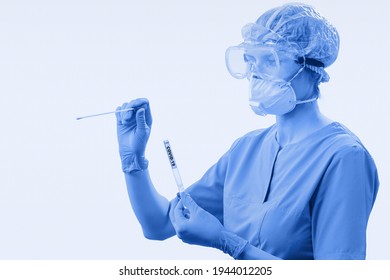 Medical Worker Holding A Swab Collection Kit For The PCR Testing Protocol Process. Diagnostic Testing For COVID-19. The Concept Of The Diagnosis Of Viral Diseases. Selective Focus. Toned