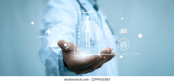 A medical worker holding virtual hologram of human skeleton in his hand on with analysis of human organ with x-ray scanner, Hi-tech technology and medical of the future concept