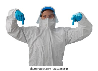 Medical Worker Infectious Disease Specialist In PPE, Goggles, Infection Protection Visor, N95 Respirator And Blue Gloves Makes A Downward Sign With His Hands. Coronavirus Global Pandemic Crisis.