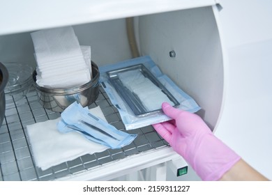 Medical Worker Taking The Instruments After Sterilisation