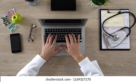 Medical Worker Typing On Laptop, Keeping Electronic Medical Records, Top View