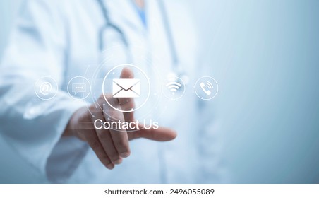 Medical worker using a laptop and touching on virtual screen contact icons email, address, live chat, internet wifi. Contact us or Customer support hotline people connect - Powered by Shutterstock