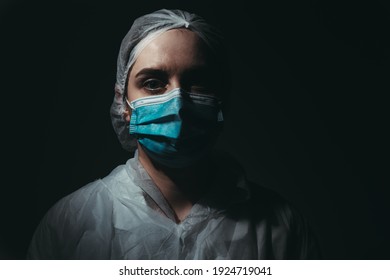 Medical Worker Wearing Medical Mask On Black Background