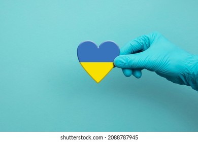 Medical Workers Hand Wearing Surgical Glove Holding Ukraine Flag Heart