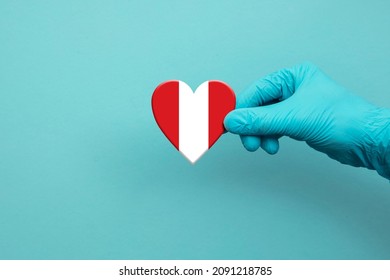 Medical Workers Hand Wearing Surgical Glove Holding Peru Flag Heart