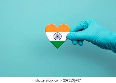 Medical Workers Hand Wearing Surgical Glove Holding India Flag Heart