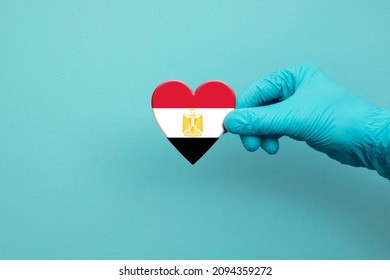 Medical Workers Hand Wearing Surgical Glove Holding Egypt Flag Heart