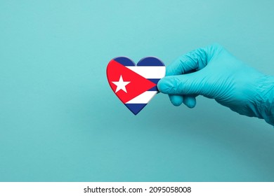 Medical Workers Hand Wearing Surgical Glove Holding Cuba Flag Heart