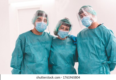 Medical workers inside hospital corridor during coronavirus pandemic outbreak - Doctor and nurse at work on Covid-19 crisis period - Health care concept - Main focus on center woman face - Shutterstock ID 1761965804