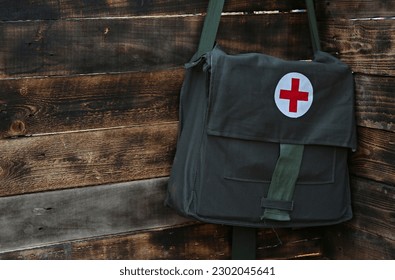 medical worker's international red cross bag with medicine - Shutterstock ID 2302045641