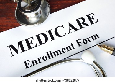 Medicare Enrollment Form Written On A Paper.  