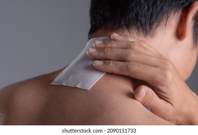 Medicated Pain Relief Patch With Man Pain Neck,office Syndrome,Health Problems From Overworked Concept.