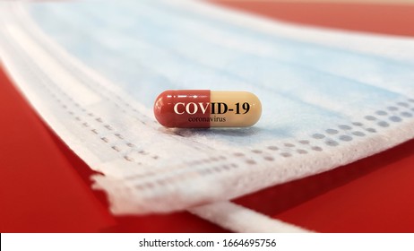 Medication of antiviral capsule(medicine) for treatment and prevention of new corona virus infection(COVID-19,novel coronavirus disease 2019 or nCoV 2019 from Wuhan on mask.Pandemic infectious concept
