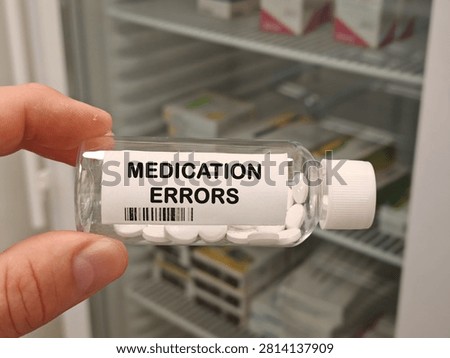 MEDICATION ERRORS medication safety topic for errors misuse adverse effects and patient safety bottle with tablets