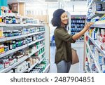 Medication, healthcare and woman in pharmacy for shopping with purchase for medical treatment supplies. Medicine, pharmaceutical and female person looking for pills in retail drugstore chemist.