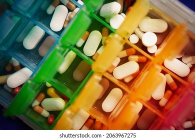 Medication, including anti rejection drugs, after a kidney transplant, stored in a weekly pill box - Shutterstock ID 2063967275