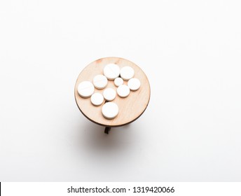 Medication Regimen. Adherence To Drug Regimen. Tips Tackling Complex Medication Regimen. Take Medicines After Food. Health Care And Medical Treatment. Vitamin Supplements. Pills On Tiny Wooden Table.