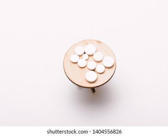 Medication Regimen. Adherence To Drug Regimen. Tips Tackling Complex Medication Regimen. Take Medicines After Food. Health Care And Medical Treatment. Vitamin Supplements. Pills On Tiny Wooden Table.