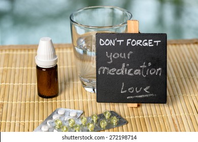 Medication Reminder On Bamboo With Medicine