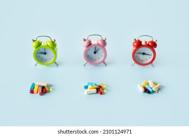 Medication Reminders. Pills, Drugs Work Bedtime, Schedule. Time To Take Medication. Color Alarm Clocks And Medical Capsules And Blister Pills Packs.