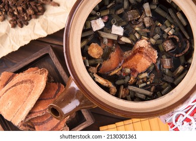 Medicinal herbs ready for decoction in a medicine pot - Shutterstock ID 2130301361
