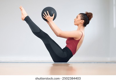 Medicine ball, exercise and woman with fitness in gym, stretching and challenge with wellness. Person, health center or equipment with girl, athlete and training with practice, flexible or breathing - Powered by Shutterstock