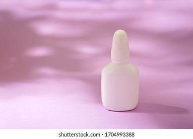 Medicine bottle nose spray on magenta background isolation - Shutterstock ID 1704993388