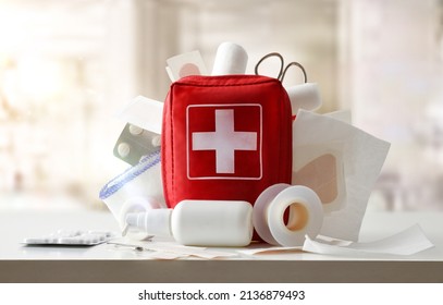Medicine cabinet of a medical center full of medical objects and tools for cures on a white table. Front view. Horizontal composition - Shutterstock ID 2136879493