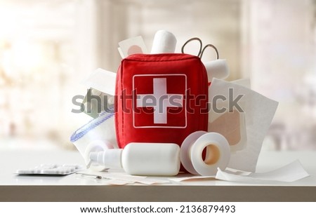 Medicine cabinet of a medical center full of medical objects and tools for cures on a white table. Front view. Horizontal composition
