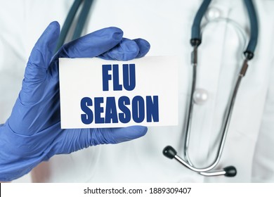 Medicine Concept. The Doctor Holds A Business Card That Says - FLU SEASON