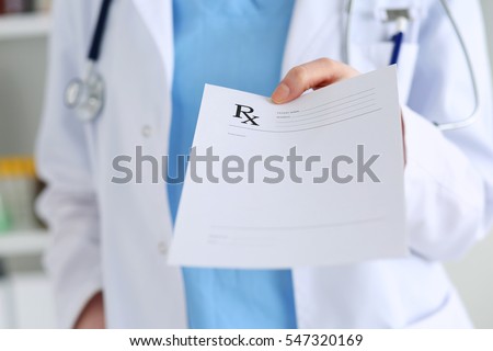 Medicine doctor hand giving prescription list to patient closeup. Healthcare, medical, prescribing treatment or legal drug store concept. Empty form ready to be used