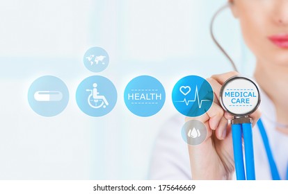 Medicine Doctor Hand Holding Stethoscope And Working With Modern Medical Icons