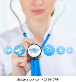 Medicine Doctor Hand Holding Stethoscope And Working With Modern Medical Icons