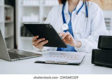 Medicine doctor hand working with modern digital tablet computer interface as medical network concept - Powered by Shutterstock