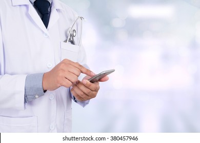 Medicine Doctor Hand Working With Modern Computer And Smart Phone With Social Media Network On Wooden Desk As Medical Concept