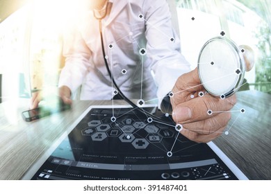 Medicine Doctor Hand Working With Modern Digital Tablet Computer With  Stethoscope As Medical Network Concept