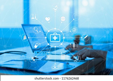 Medicine doctor or medical students with stethoscope using digital tablet laptop,Health Check with digital system support for patient with medical icon at hospital, Medical network technology concept. - Powered by Shutterstock