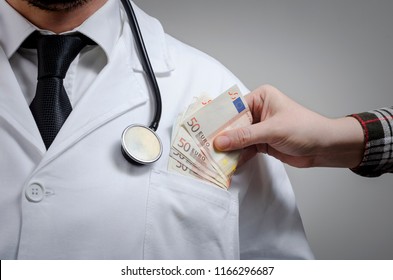 Medicine doctor receiving large amount of Euro banknotes as a bribe. Corruption in Health Care Industry concept.