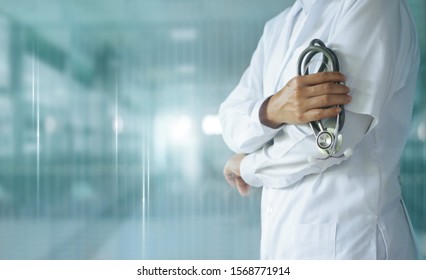 Medicine doctor with stethoscope in hand on hospital background,  Medical technology, Healthcare and Medical concept.
