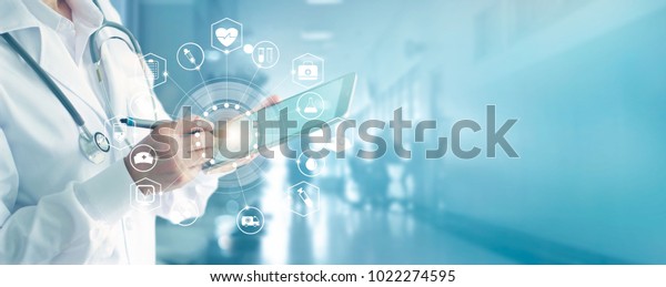 Medicine doctor and\
stethoscope touching icon medical network connection with modern\
interface on digital tablet in hospital background. Medical\
technology network\
concept