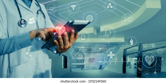 Medicine Doctor Touching On Tablet And Digital Healthcare And Network Connection With Modern Virtual Screen Interface Icons On The Hospital Background, Medical Technology And Network Concept.