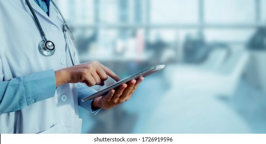Medicine doctor touching tablet. Medical technology and futuristic concept. - Shutterstock ID 1726919596